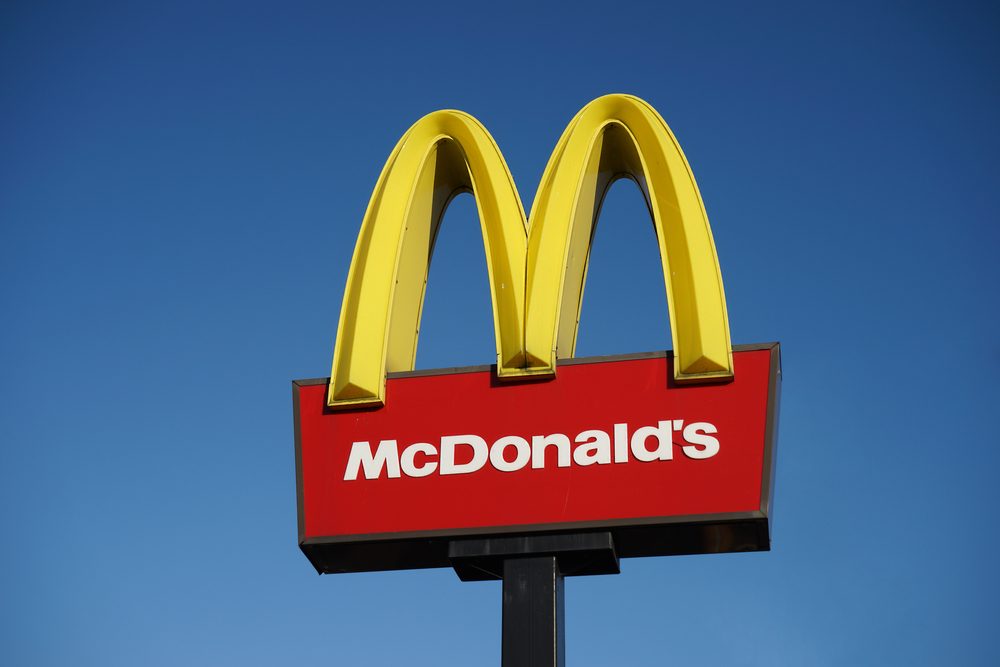 LONDON - DEC 13: McDonalds logo on blue sky background on Dec 13, 2014, London, UK. It is the world's largest fast food chain, over 31,000 restaurants worldwide, serve 58 million customers each day.