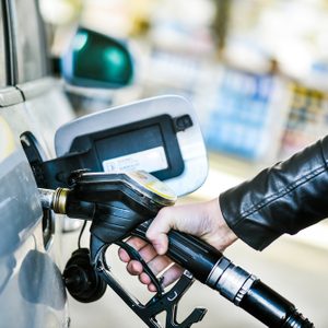 Refueling car at gas station. Filling fuel.