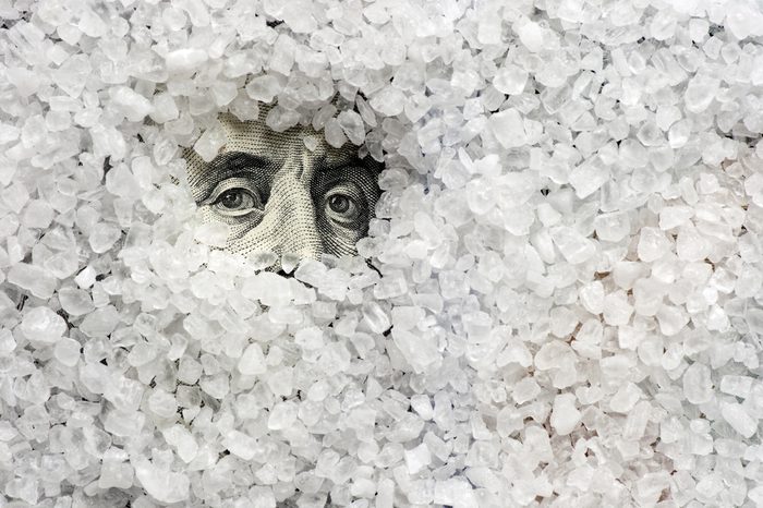 Sea salt crystals on one hundred dollars