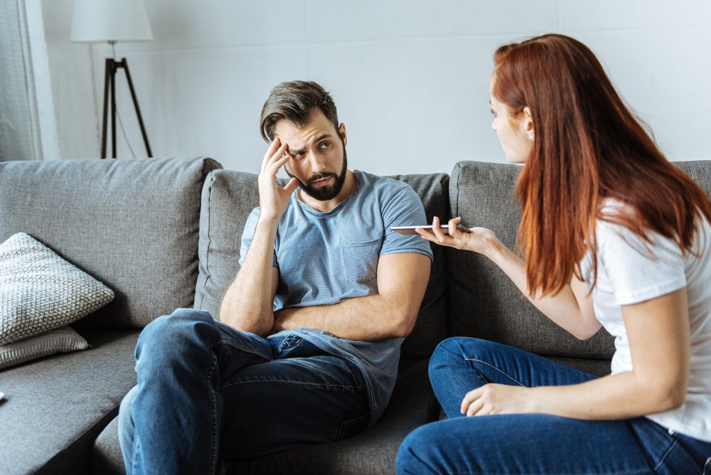 Unhappy angry woman talking to her boyfriend