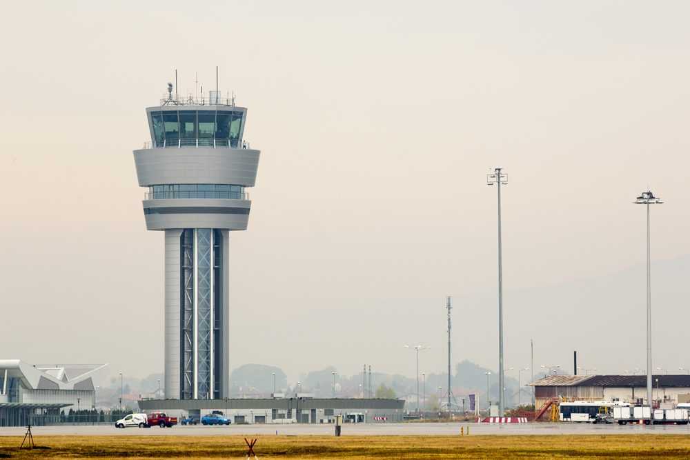 Airport control tower at Sofia's airport in a foggy weather.