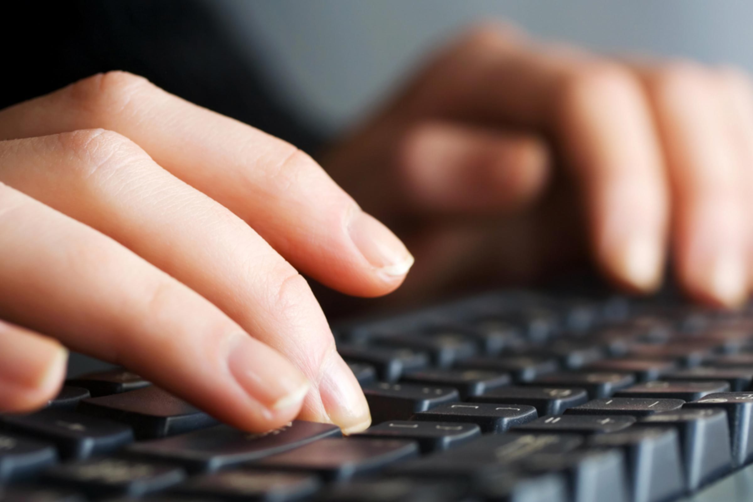 hands close up laptop computer keyboard