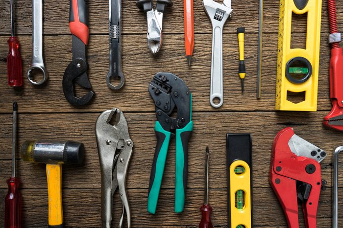 Old tools equipment on wood table background, engineering concept