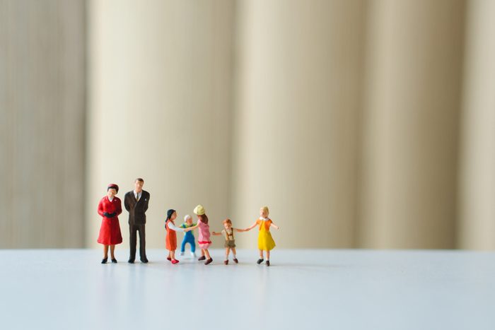 Miniature people, happy family playing together using as family concept