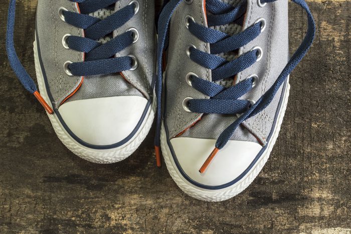 Sneakers on an old wooden surface. Sports shoes