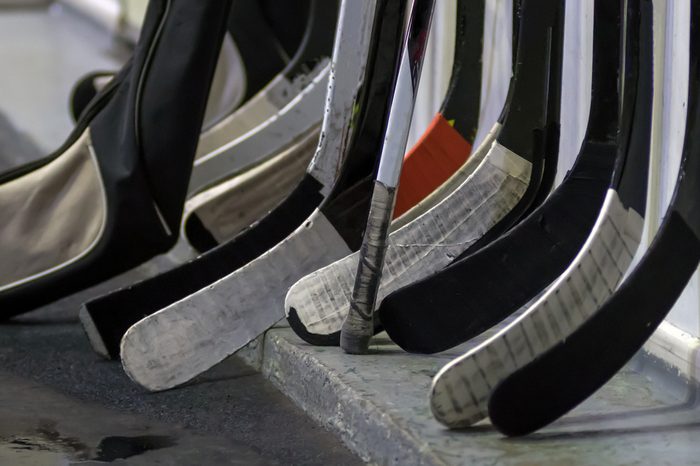 Hockey sticks near the locker room before the game