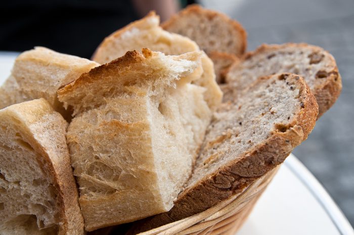 bread in basket - little roll breads in basket on table