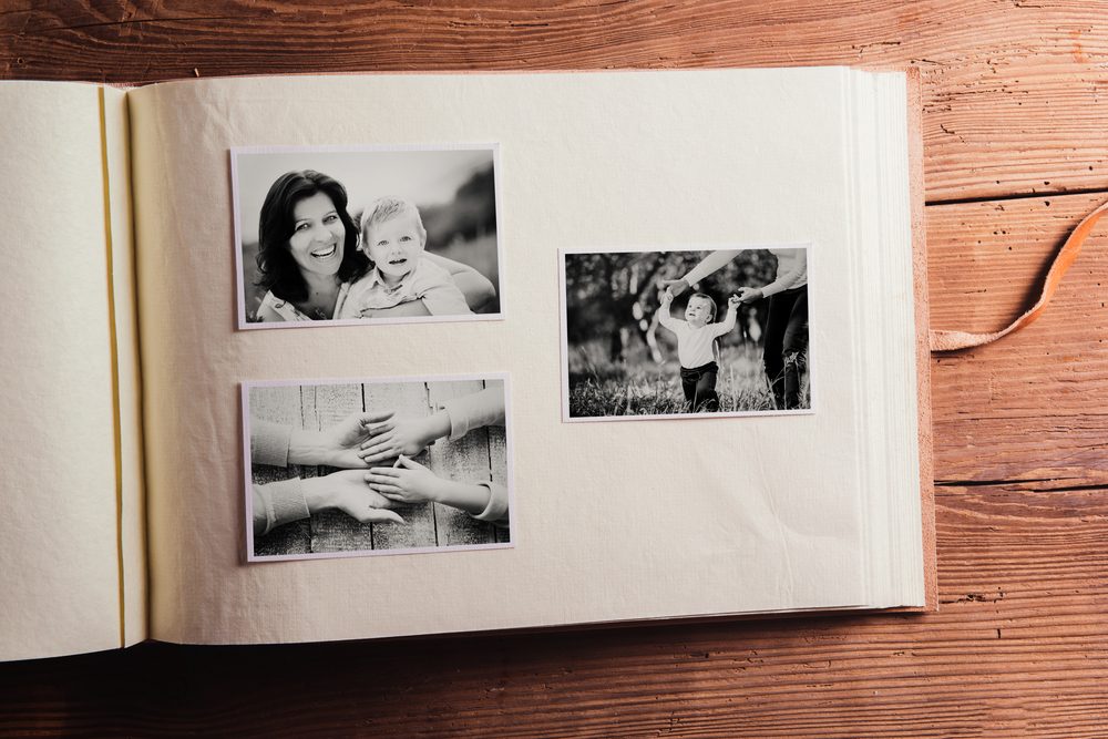 Mothers day composition. Photo album, black-and-white pictures. Mother with child. Mothers day celebration. Happy mother and son. Concept with family photos.