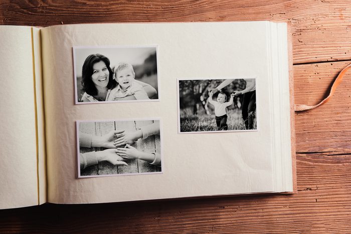 Mothers day composition. Photo album, black-and-white pictures. Mother with child. Mothers day celebration. Happy mother and son. Concept with family photos.