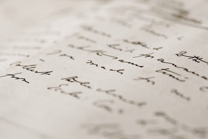 A close up with a narrow depth of field of a hand-written letter