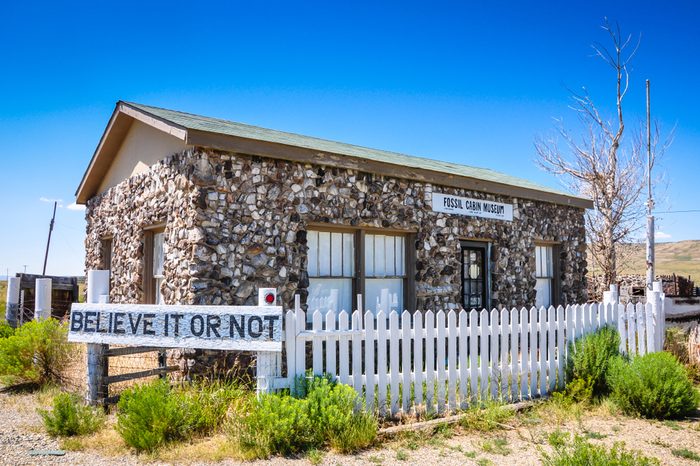 Medicine Bow, WY / USA - July 17, 2013: Beginning about 1915, Thomas Boylan used 5,796 dinosaur bones from nearby Como Bluff to build this cabin. The curiousity was used to house a museum.