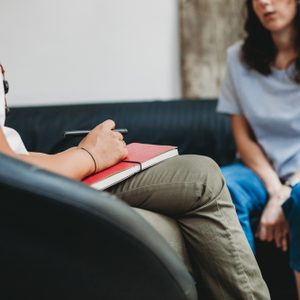 Psychotherapy session, woman talking to his psychologist in the studio