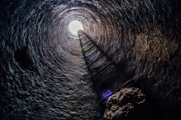 View from inside vertical tube downcast shaft with ladder