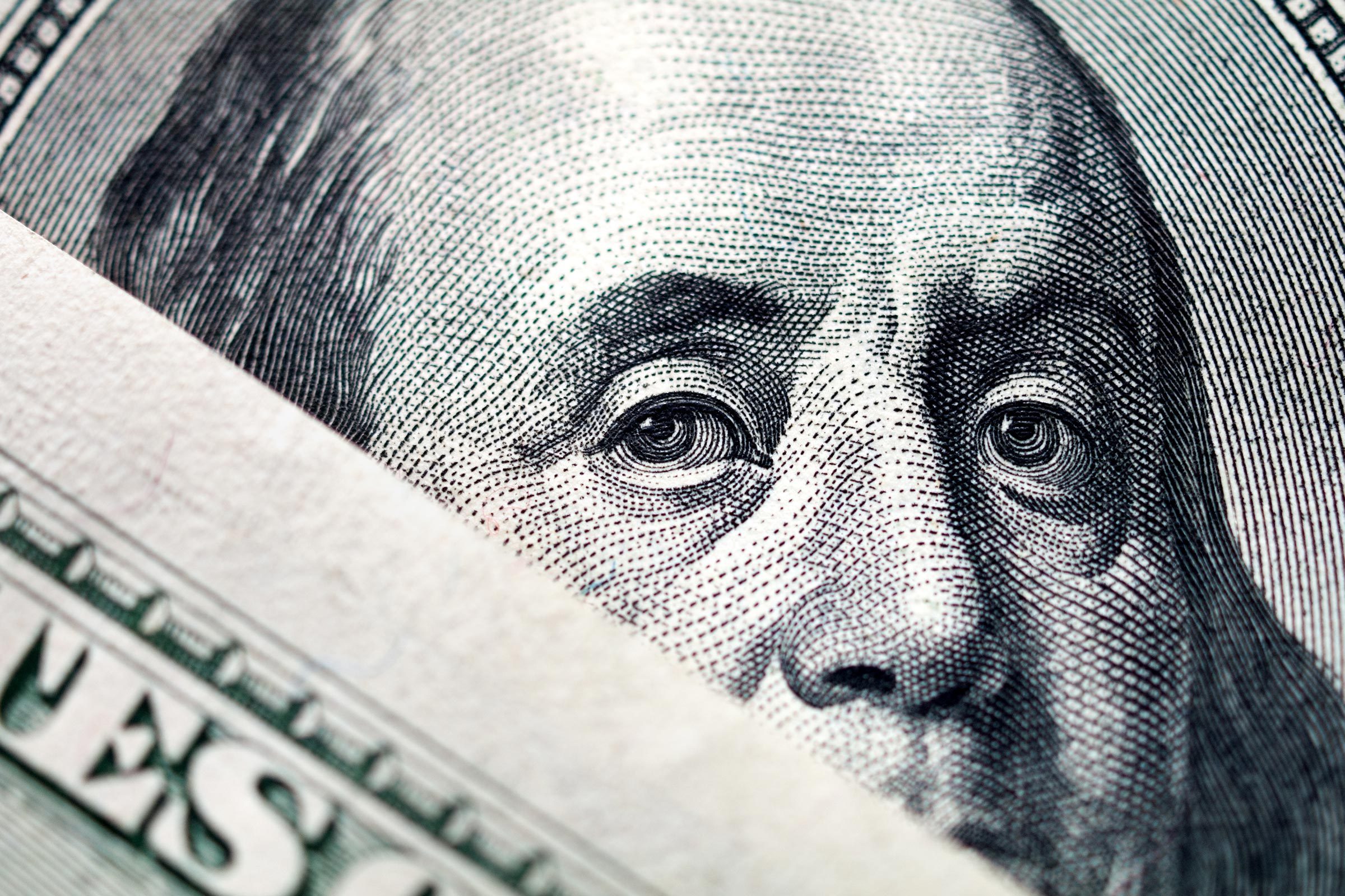 cloes up hundred dollar bill