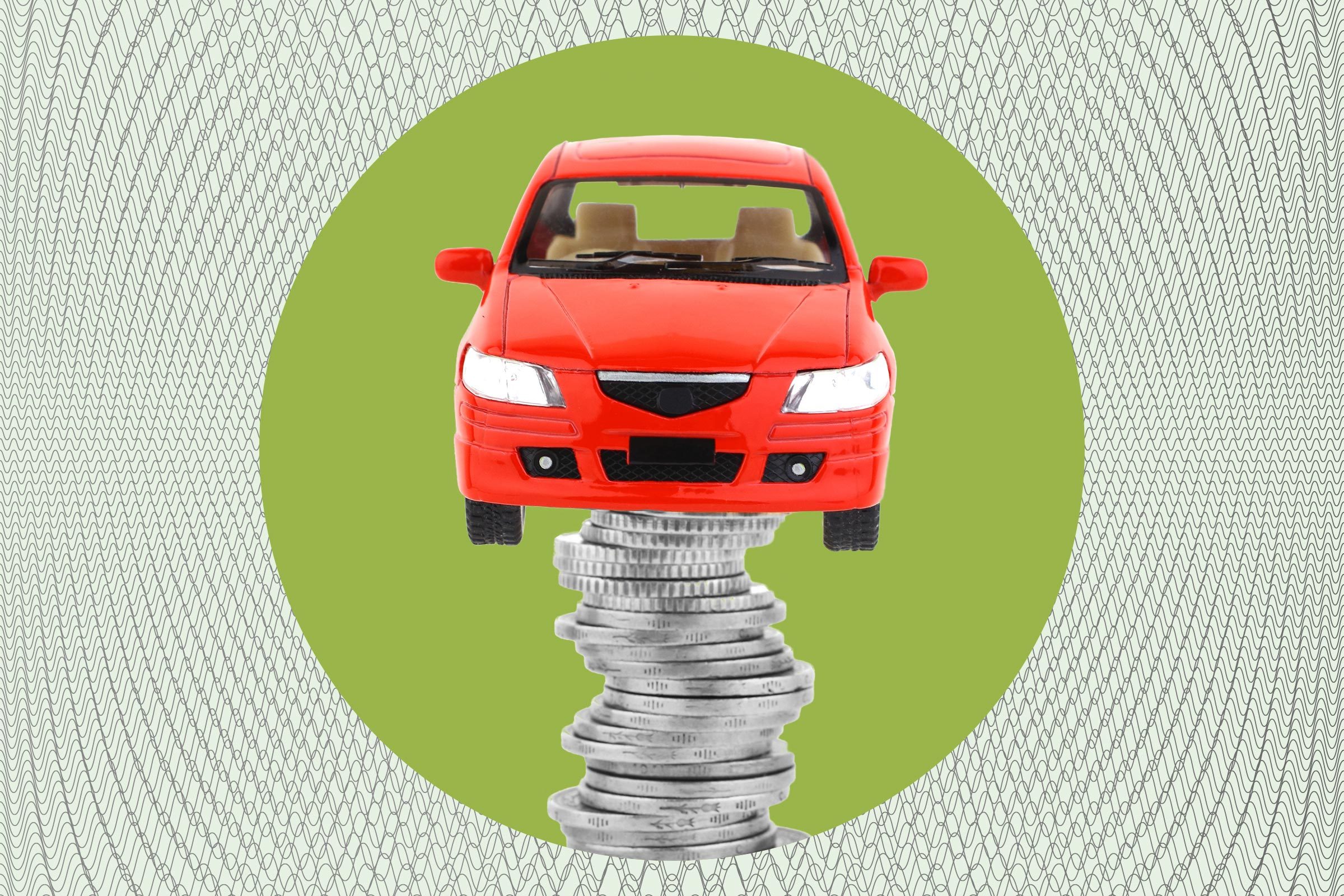 a red toy car on a stack of coins