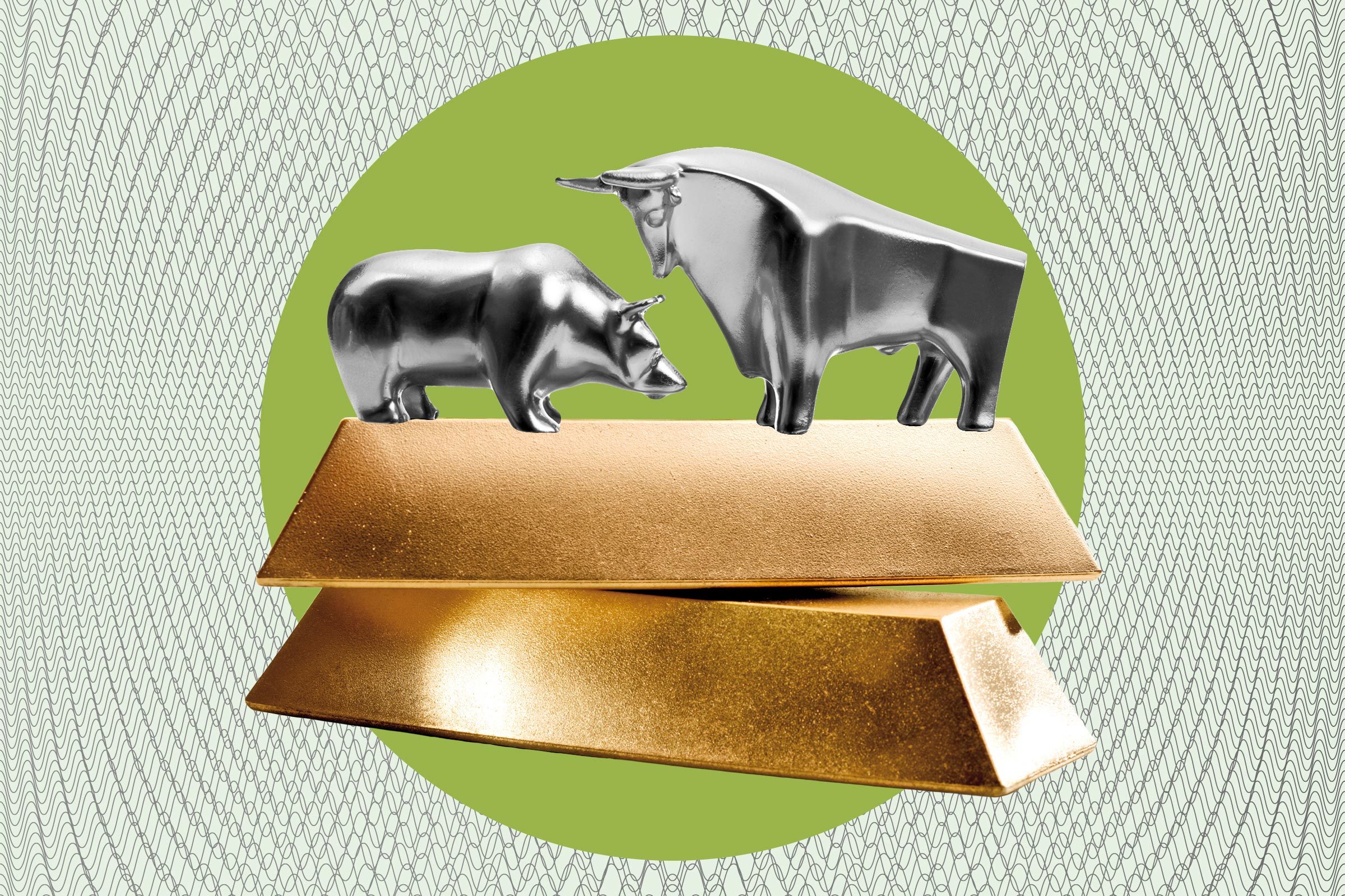 bear and bull on a stack of gold bars