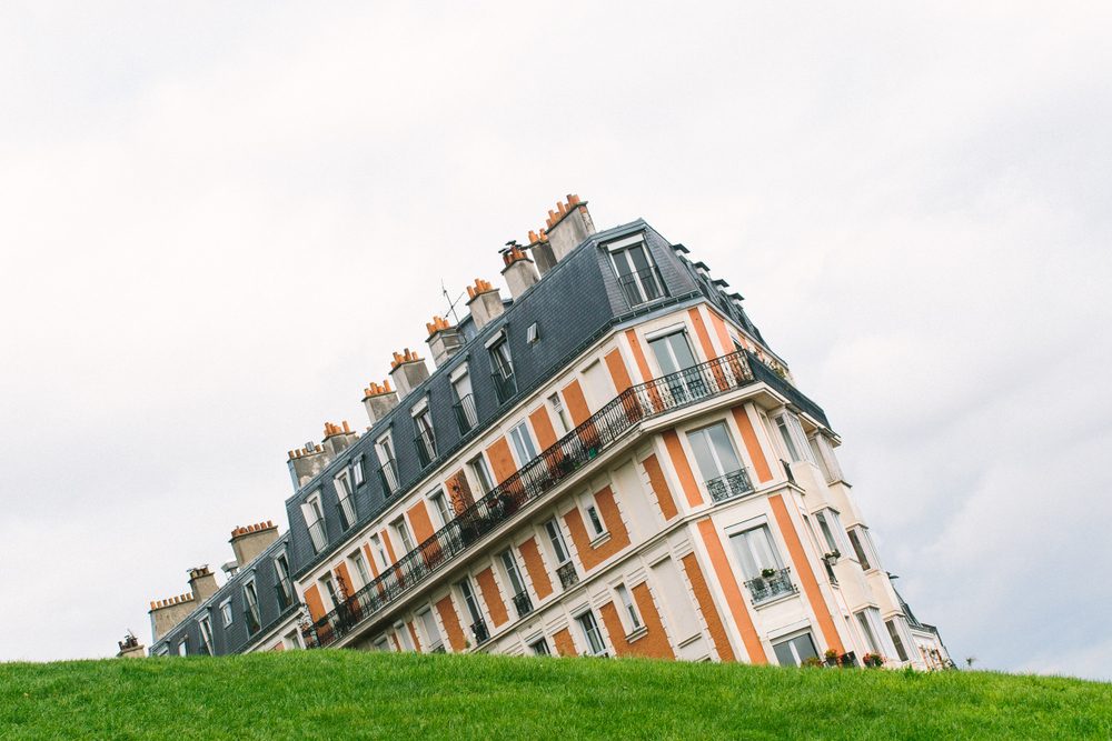 Sinking house on Montmartre hill taken with an unusual angle, Paris, France