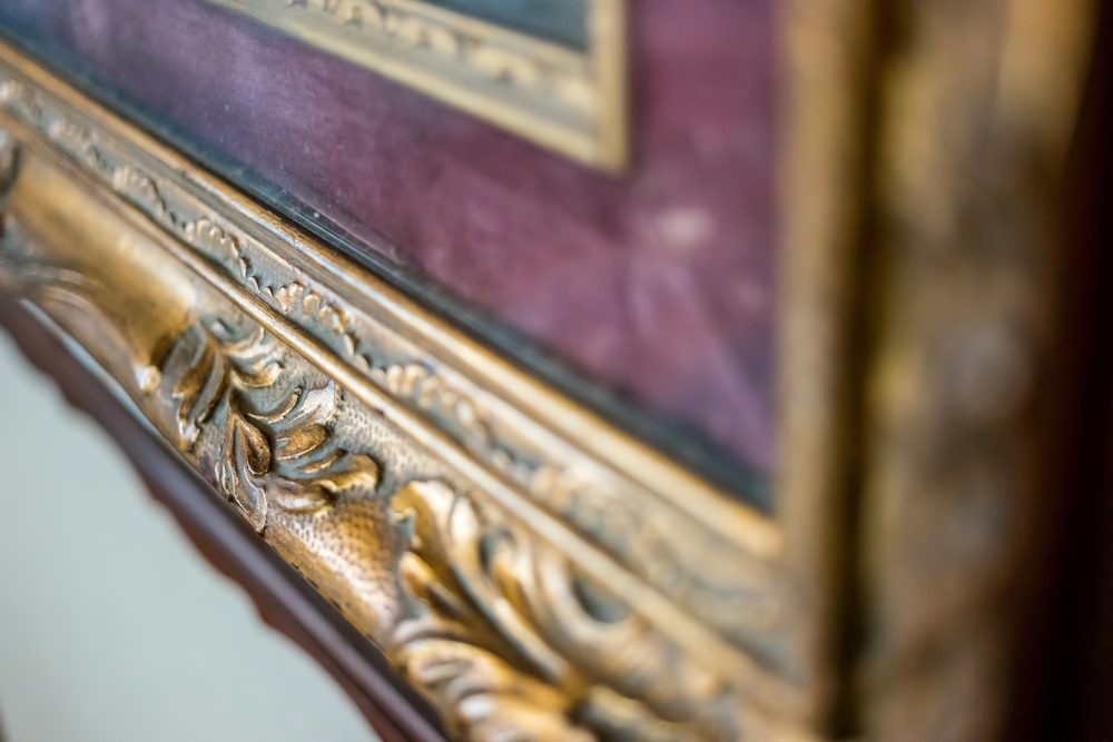 Old gilded frame. Antique frame with ornament. Recognize the art.