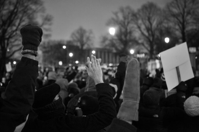 Hands Up -Des Moines, Iowa, USA - February 2, 2017: Protestors raise their hands a the march at the Iowa State Capitol to protest President Trump's Muslim Ban on February 2, 2017