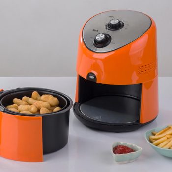 Air fryer machine with chicken and french fried
