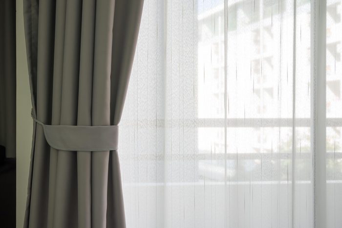 Empty curtain interior in bedroom with sunlight