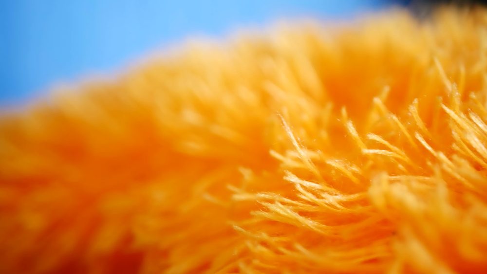 Yellow micro fiber cloth in true macro close up revealing it's texture