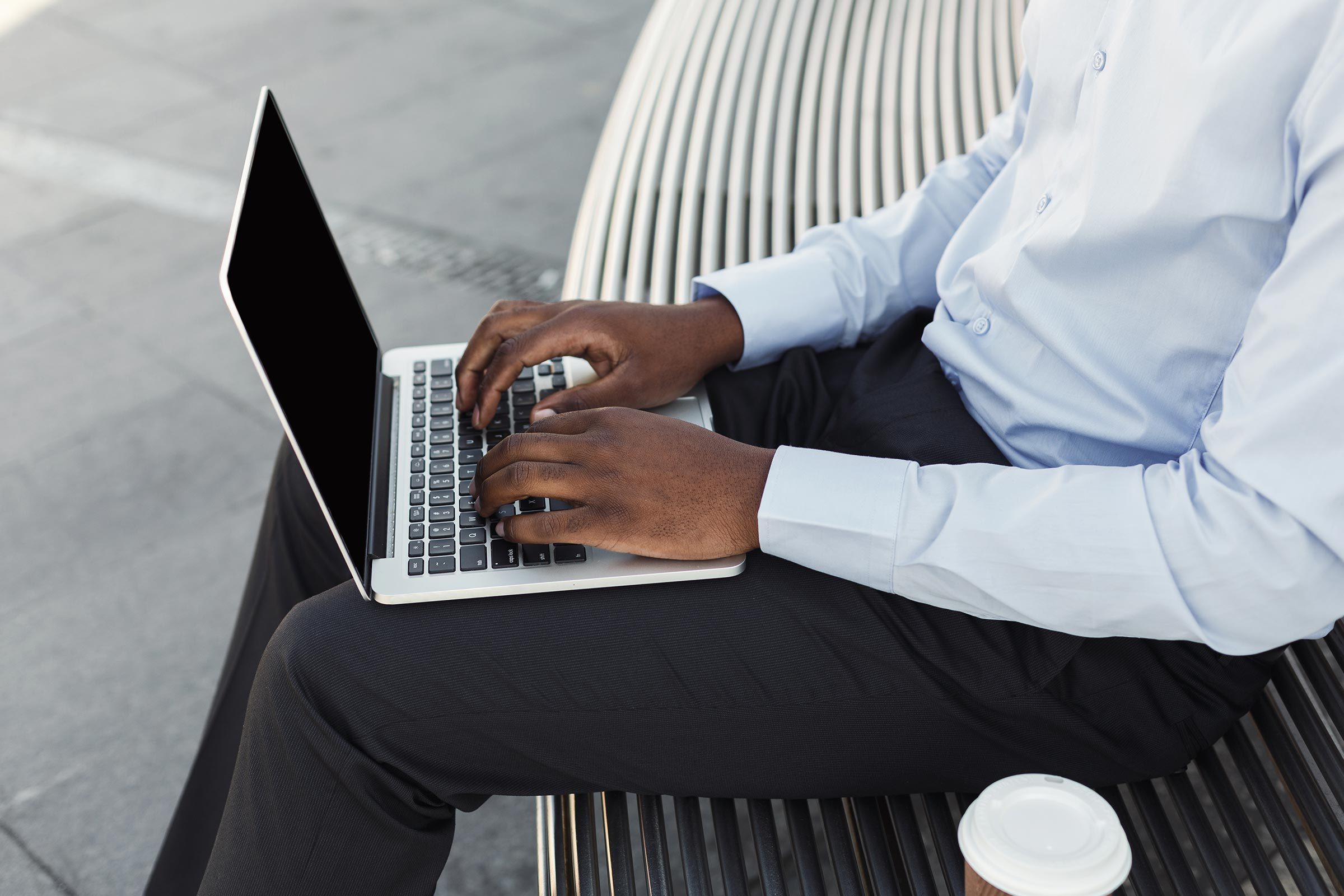 man typing laptop computer