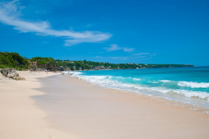 Sunny beach called Dreamland in Bali, Indonesia.