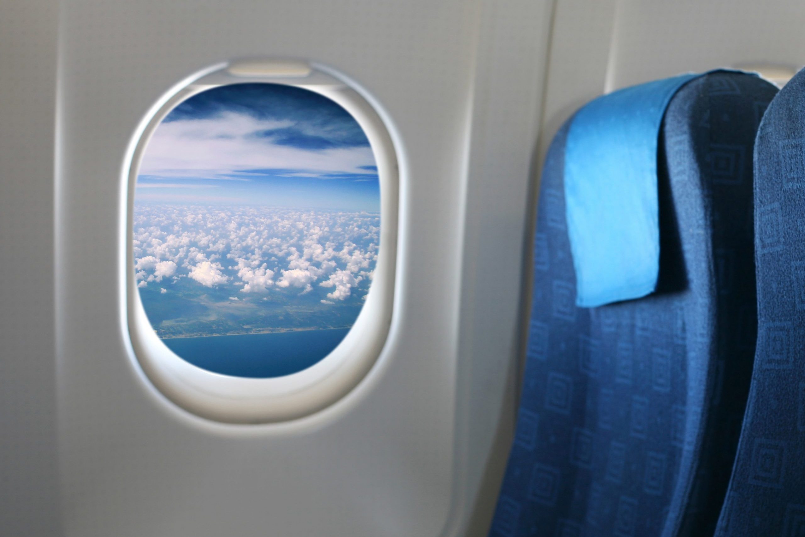 Airplane seat and window inside an aircraft