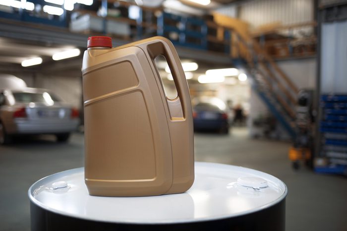 Plastic container for motor oil in car repair shop