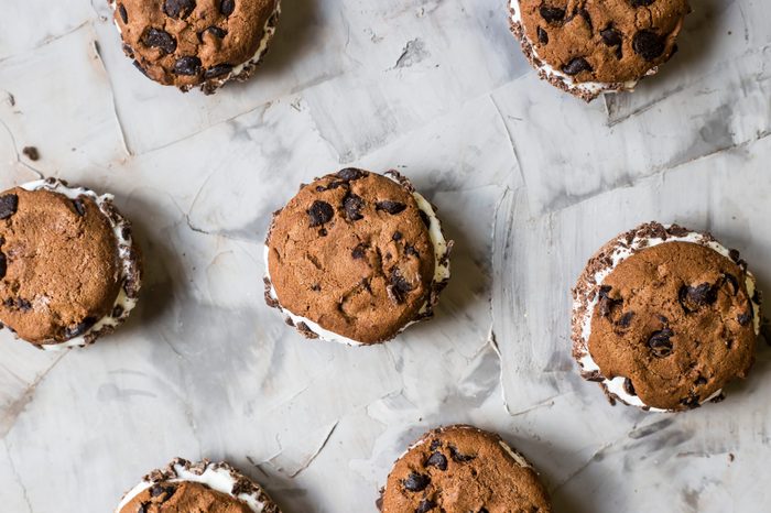 Sandwich ice cream with chocolate cookies on a gray background. Summer dessert concept. Top view, flat lay