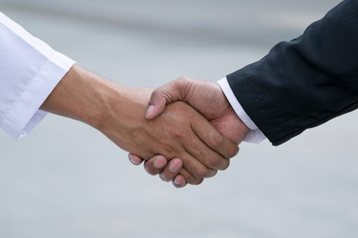 Arab businessmen worker handshaking on construction site