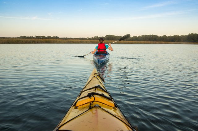 Sea kayaking, view of kayaker from first boat