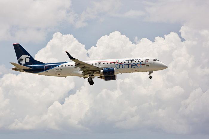 MIAMI, USA - July 3, 2016: An Embraer 190 Aeromexico landing at Miami International Airport. Aeromexico is the flag carrier airline of Mexico and the biggest Mexican Airline.