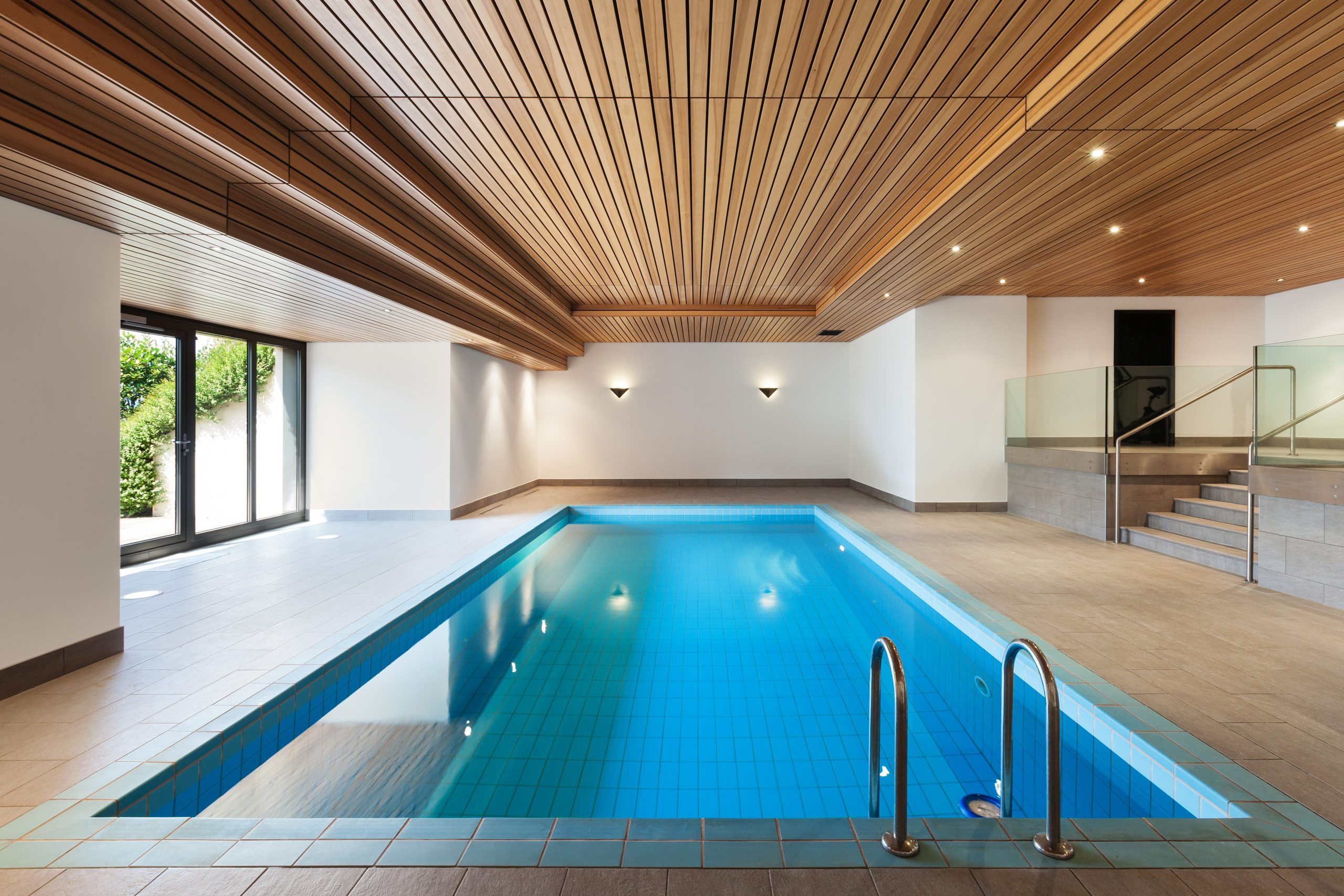 luxury apartment with indoor pool, wooden ceiling