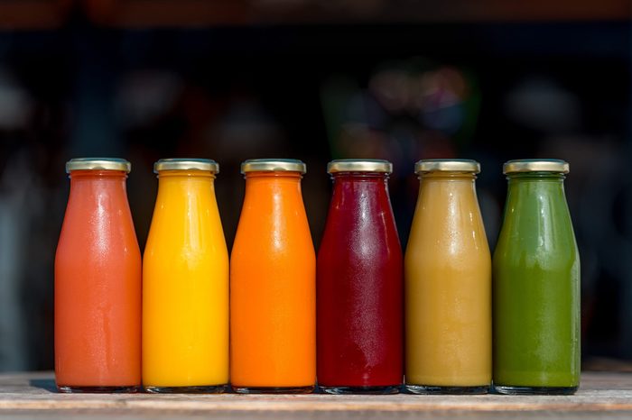 Raw vegetable and fruit juices in glass bottles