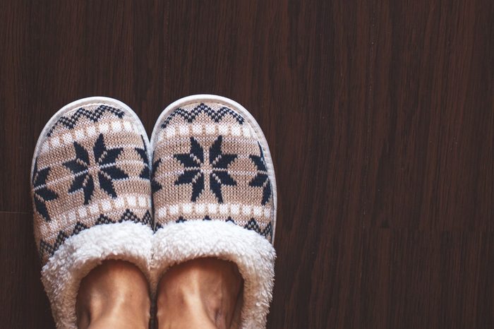 Slippers on floor at bedroom. Soft comfortable home slipper