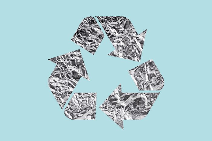 aluminum foil in recycle symbol on a blue background