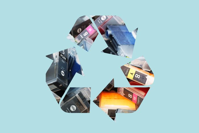 ink cartridge in a recycle symbol on a blue background