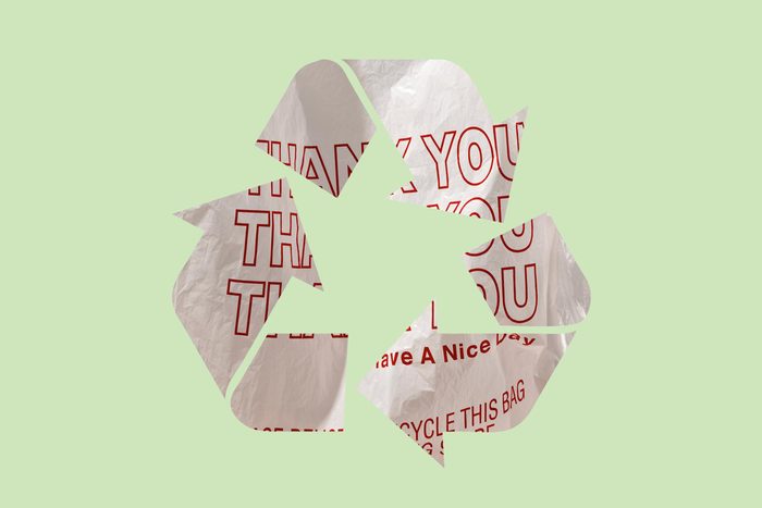 plastic grocery bag in a recycle symbol on a green background