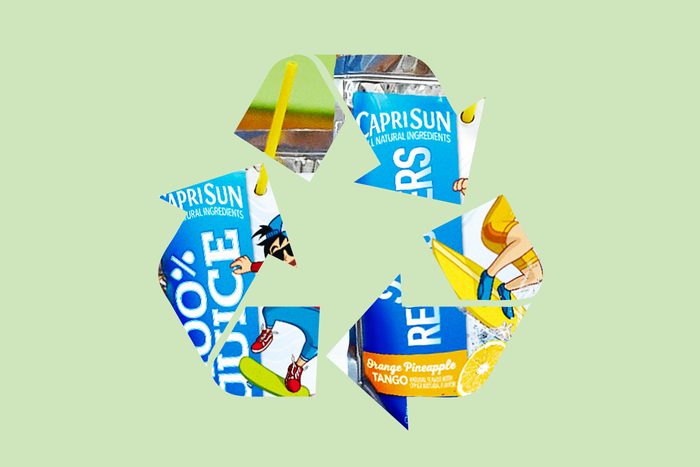 capri sun juice pouch in a recycle symbol on a green background