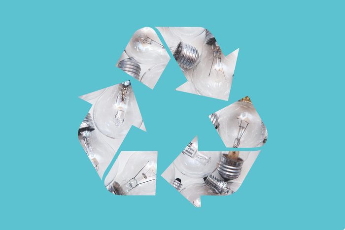 light bulbs in a recycle symbol on a blue background