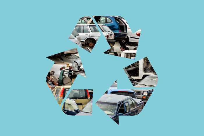 old cars in a recycle symbol on a blue background