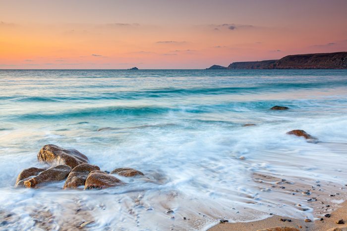 Sunset on the beach at at Sennen Cove on the Penwith Coast of Cornwall England UK Europe