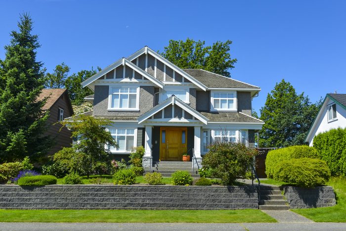 Luxury family house with landscaping and blue sky background. Canada.