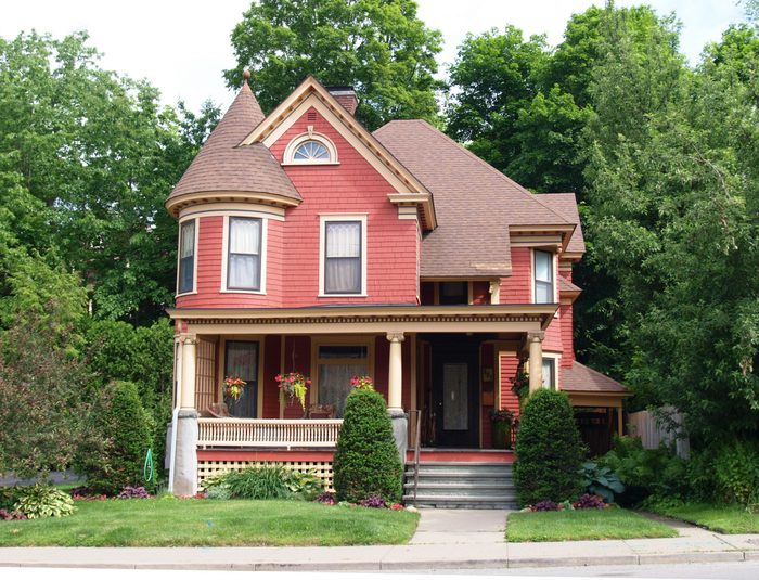 Beautiful Queen Anne style Victorian house surrounded by mature trees