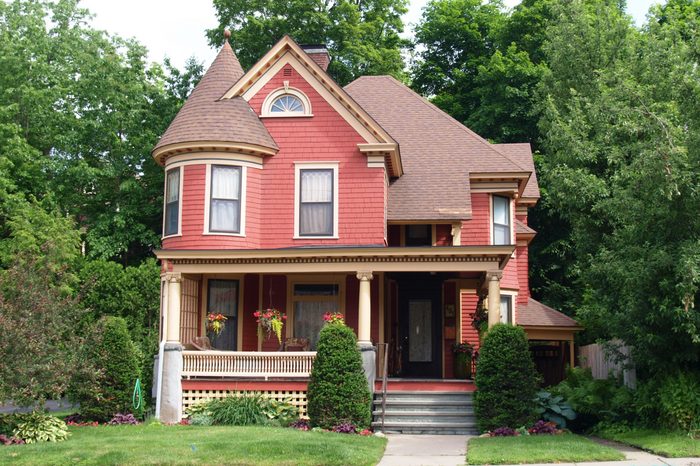 Beautiful Queen Anne style Victorian house surrounded by mature trees