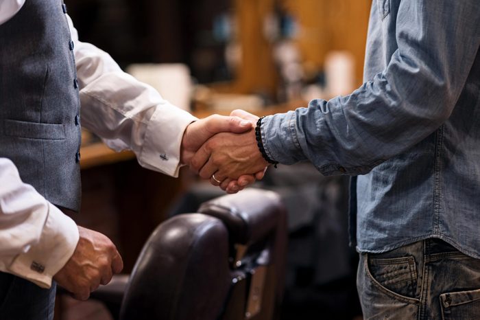 Close up of two man shaking hands