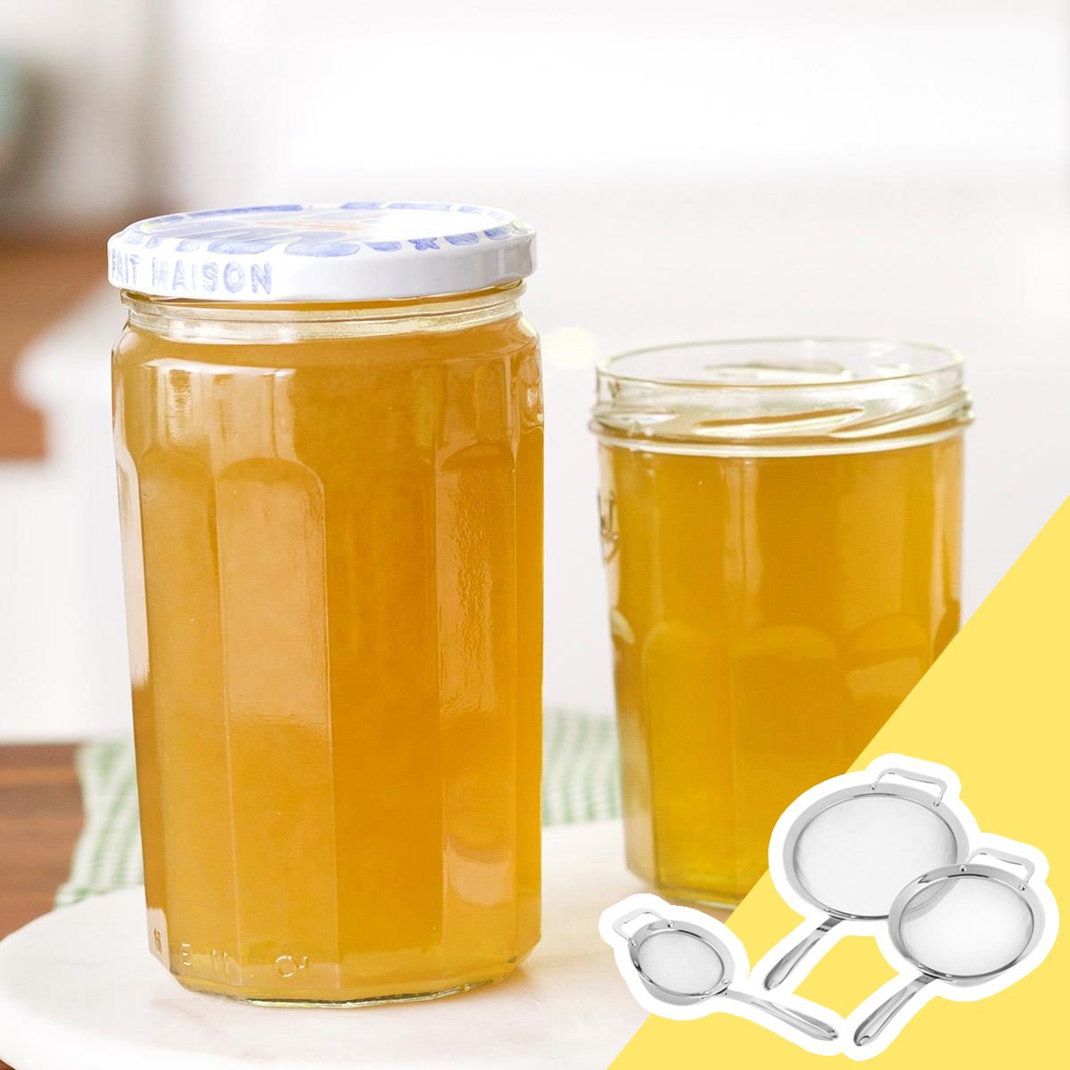 Strainer and jars of broth