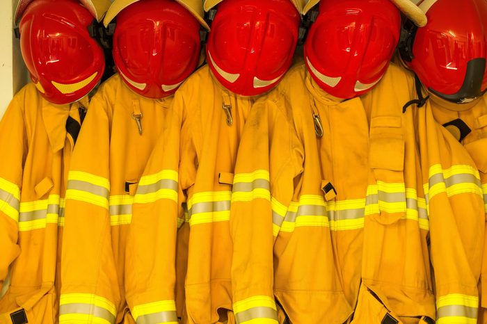 Firefighters in yellow fire-proof uniform